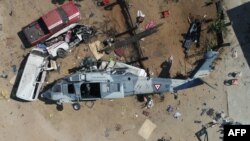 Aerial view of the military helicopter that fell on a van in Santiago Jamiltepec, Oaxaca state, Mexico, on February 17, 2018. 