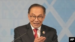 FILE - Malaysian Prime Minister Anwar Ibrahim delivers his speech during the closing ceremony of the Association of Southeast Asian Nations (ASEAN) Summit in Vientiane, Laos, Oct. 11, 2024.