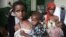 Somali girls carry their malnourished siblings in Banadir hospital, south of capital Mogadishu August, 28, 2011.