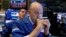 Specialists Jay Woods, right, and Thomas McArdle work on the floor of the New York Stock Exchange, Oct. 11, 2018. 