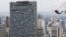 A base jumper leaps from Martinelli building during a competition in Sao Paulo, Brazil, Dec. 4, 2021. 