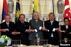 U.S. Secretary of State Rex Tillerson (center) poses with ASEAN foreign ministers before a working lunch at the State Department in Washington, May 4, 2017.