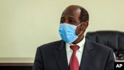 Paul Rusesabagina appears in front of media at the headquarters of the Rwanda Bureau of investigations building in Kigali, Rwanda, Aug. 31, 2020.