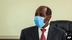 Paul Rusesabagina appears in front of media at the headquarters of the Rwanda Bureau of investigations building in Kigali, Rwanda, Aug. 31, 2020.