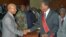 Burkina Faso President Blaise Compaore, right, greets Guinea presidential frontrunner Cellou Dalein Diallo, as he meets with members of the transitional government and presidential candidates at the People's Palace in Conakry, Guinea (file photo – 03 Aug.