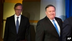 Secretary of State Mike Pompeo, right, followed by Brian Hook, special representative for Iran. (Aug. 16, 2018)