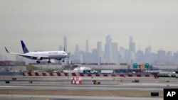 FILE - A United Airlines jet prepares to land on Jan. 23, 2019, at Newark (N.J.) Liberty International Airport, one of five U.S. airports where travelers from Uganda will be diverted to screen for Ebola. 