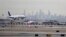 A United Airlines jet prepares to land at Newark Liberty International Airport a day after a temporary grounding of aircraft was placed after reports of drones in the flight path in Newark, N.J., Jan. 23, 2019.