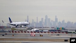 FILE - A United Airlines jet prepares to land on Jan. 23, 2019, at Newark (N.J.) Liberty International Airport, one of five U.S. airports where travelers from Uganda will be diverted to screen for Ebola. 