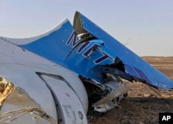 The tail of a Metrojet plane that crashed in Hassana, Egypt on Saturday, Oct. 31, 2015.