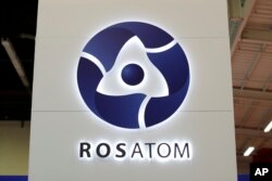 FILE - The logo of Russian state nuclear monopoly Rosatom at the World Nuclear Exhibition 2014, the trade fair event for the global nuclear energy sector, in Le Bourget, near Paris, Oct. 14, 2014.