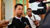 FILE - Arnt Khaung Min, deputy chief editor of the weekly Myanmar Herald, speaks to journalists as he leaves a township court in Naypyitaw, Myanmar, July 21, 2015. He and the paper's chief editor Kyaw Swa Win were fined for violating the media law by printing articles affecting an individual's reputation.