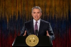 FILE - Colombia's President Ivan Duque addresses the nation in a televised speech, in Bogota, Colombia, Nov. 22, 2019.