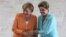 German Chancellor Angela Merkel (L) and Brazil’s President Dilma Rousseff pose for photos at the Planalto Presidential Palace, in Brasilia, Brazil, Aug. 20, 2015.