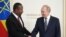 FILE - Russian President Vladimir Putin shakes hands with Ethiopian Prime Minister Abiy Ahmed during a meeting on the sidelines of Russia-Africa summit in Saint Petersburg, Russia, July 26, 2023.