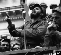 FILE - Rebel leader Fidel Castro draws a laugh from the crowd in the street as he makes a speech in Colon, Jan. 7, 1959.