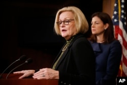 FILE - Sen. Claire McCaskill, D-Mo., left, participates in a news conference on Capitol Hill in Washington, March 6, 2014.