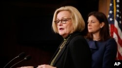 FILE - Sen. Claire McCaskill, D-Mo., left, and Sen. Kelly Ayotte, R-N.H., participate in a news conference on Capitol Hill in Washington, Thursday, March 6, 2014, following a Senate vote on military sexual assaults.