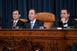 House Intelligence Committee Chairman Adam Schiff, D-Calif., center, flanked by Daniel Goldman, director of investigations for the Democrats, left, and Rep. Devin Nunes, R-Calif, the ranking member.