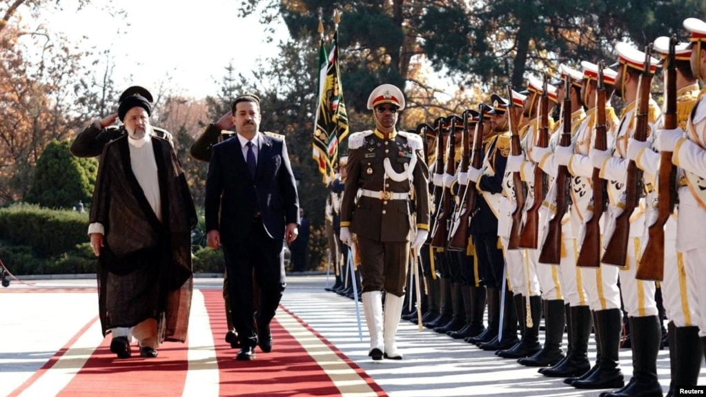 Iranian President Ebrahim Raisi walks with Iraqi Prime Minister Mohammed Shia al-Sudani during a welcoming ceremony in Tehran, Iran Nov. 29, 2022. (Iraqi Prime Minister Media Office/Handout)