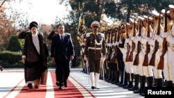 Iranian President Ebrahim Raisi walks with Iraqi Prime Minister Mohammed Shia al-Sudani during a welcoming ceremony in Tehran, Iran Nov. 29, 2022. (Iraqi Prime Minister Media Office/Handout)