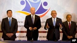 Honduras' President Juan Orlando Hernandez, left, U.S. Vice President Joe Biden, second left, and El Salvador's President Salvador Sanchez, right, stand as Guatemala's President Otto Perez Molina, second from right, talks during a working session in Guatemala City, Tuesday, March 3, 2015. 