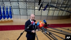 European Council President Charles Michel speaks with the media as he arrives for an EU summit at the European Council building in Brussels, Thursday, October 26, 2023. 