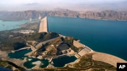 FILE - Pakistan's biggest Tarbela Dam is observed from a helicopter in Tarbela, Nov. 18, 2018. Cash-strapped Pakistan should pursue clean energy instead of relying on coal, nuclear and hydroelectric power, according to a report release on Dec. 5, 2018.