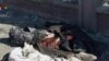 جمع آوری اجساد از خيابانهای شهر حلب