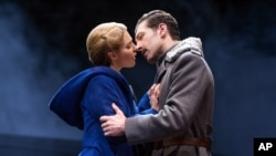 In this photo, actors Kelli Barrett and Tam Mutu play star-crossed lovers in the play "Doctor Zhivago," 2015 on stage in New York City. (Matthew Murphy via AP)