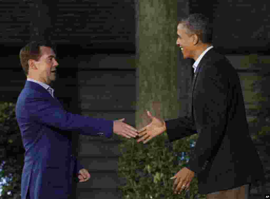 President Barack Obama, right, shakes hands with Russia's Prime Minister Dmitry Medvedev on arrival for the G8 Summit Friday, May 18, 2012 at Camp David, Md. (AP Photo/Charles Dharapak)