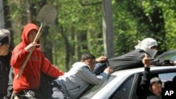 A group of Kyrgyz in the capital, Bishkek. New unrest erupted in Kyrgyzstan as hundreds of rioters armed with sticks and stones clashed with ethnic Russian and Turkish residents in the village of Mayevka, 19 Apr 2010