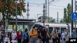 French passengers step out of the tram at a station in Kehl, on June 15, 2020, on the reopening day of the borders between France and Germany, closed as part of measures taken to stop the spread of the COVID-19 pandemic caused by the novel coronavirus. (P