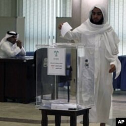 A man casts his ballot at a polling station at Prince Salman center in Riyadh September 29, 2011