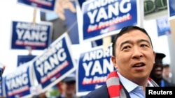 FILE - Democratic 2020 U.S. presidential candidate and entrepreneur Andrew Yang greets supporters at the New Hampshire Democratic Party state convention in Manchester, N.H., Sept. 7, 2019. 