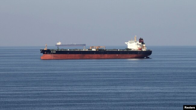FILE - Oil tankers pass through the Strait of Hormuz, Dec. 21, 2018.