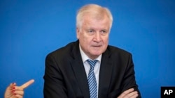 German Interior Minister Horst Seehofer presents his 'master plan migration' in the interior ministry in Berlin, July 10, 2018.