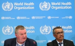 Michael J. Ryan, Executive Director of the WHO Health Emergencies Program and Director-General of the WHO Tedros Adhanom Ghebreyesus, attend a news conference on the coronavirus in Geneva, Switzerland, Feb. 24, 2020.