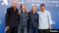 Director Martin McDonagh, actors Sam Rockwell, Frances McDormand and Woody Harrelson pose during a photocall for the movie "Three Billboards Outside Ebbing, Missouri" at the 74th Venice Film Festival in Venice, Italy, Sept. 4, 2017.