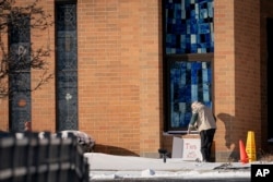 A man leaves a sign with the words "This was not okay," at Covington Catholic High School in Park Kills, Ky., Sunday, Jan 20, 2019.