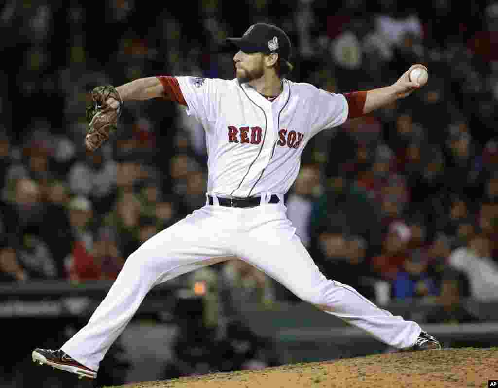 Boston Red Sox relief pitcher Craig Breslow throws during the seventh inning of Game 2 of baseball's World Series against the St. Louis Cardinals, Oct. 24, 2013, in Boston. 