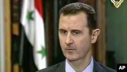 Syria's President Bashar al- Assad during an interview broadcast on Al-Manar Television on May 30, 2013. 