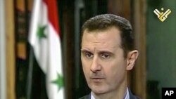 Presiden Suriah Bashar al- Assad dalam wawancara televisi Al-Manar (30/5).