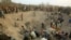 FILE - Gangs of illegal miners dig for diamonds in Marange, eastern Zimbabwe, Nov. 1, 2006. 