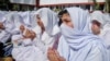 Students pray for the speedy recovery of schoolgirl Malala Yousufzai at a college in Peshawar