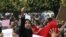 Protesters shout slogans during a demonstration in the center of Tunis, 19 January 2011.
