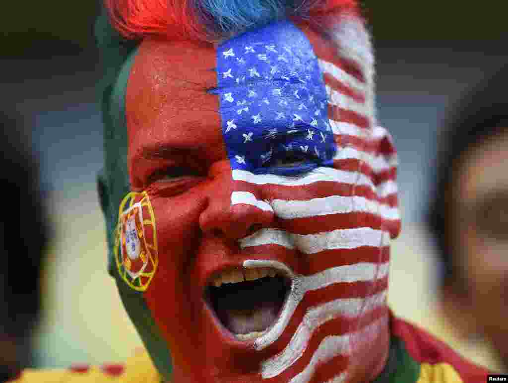 A fan shows his colors before the match between Portugal and U.S. at the Amazonia arena in Manaus, June 22, 2014.