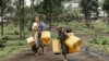 Residents carry jerrycans on their way to collect water from a water point installed by Doctors Without Borders (MSF) in Mugunga, Goma, Democratic Republic of Congo, Feb. 11, 2025. 