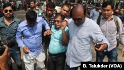 An opposition BNP activist is being arrested by plainclothes policemen in Dhaka. In 2018, thousands of opposition leaders and activists were arrested in Bangladesh on allegedly trumped up cases of political violence. 