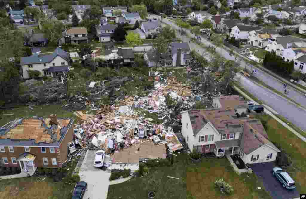 A home on the 1800 block of Princeton Circle is leveled after an overnight tornado swept through the area in Naperville, Illinois.